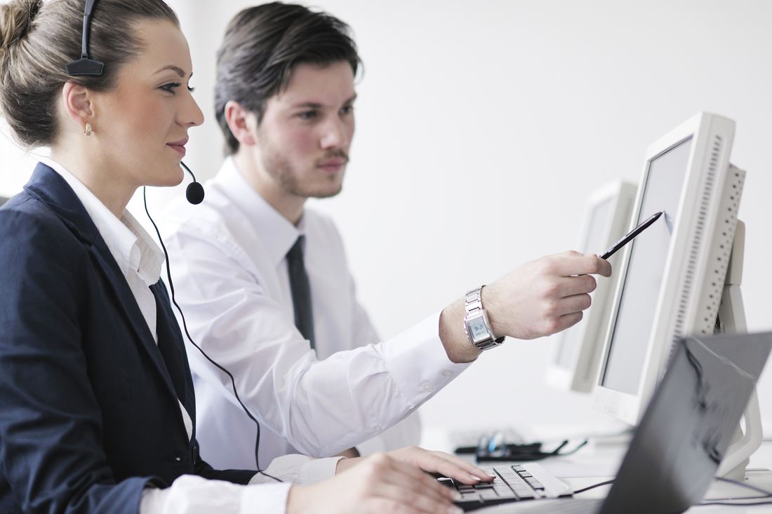 IT support technicians working together at a computer